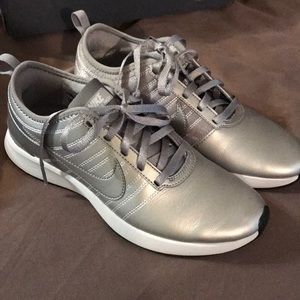 Silver Nike running shoes, size 6